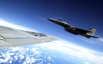 F 15 Eagle flies alongside a KC 135 Stratotanker screenshot