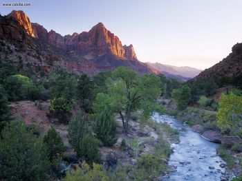 The Watchman Towers Over The Virgin River At Sunset Zion National Park Utah screenshot